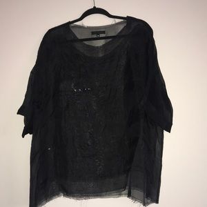 Sheer black sequined blouse by Louisa Babouryan